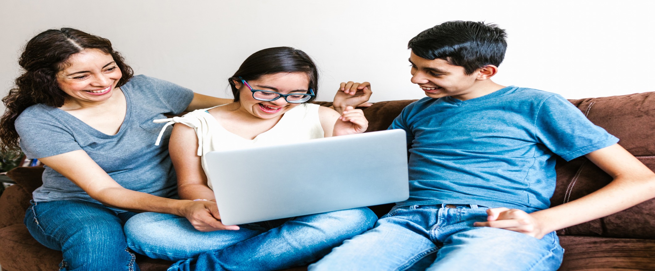 Family on the couch on a computer